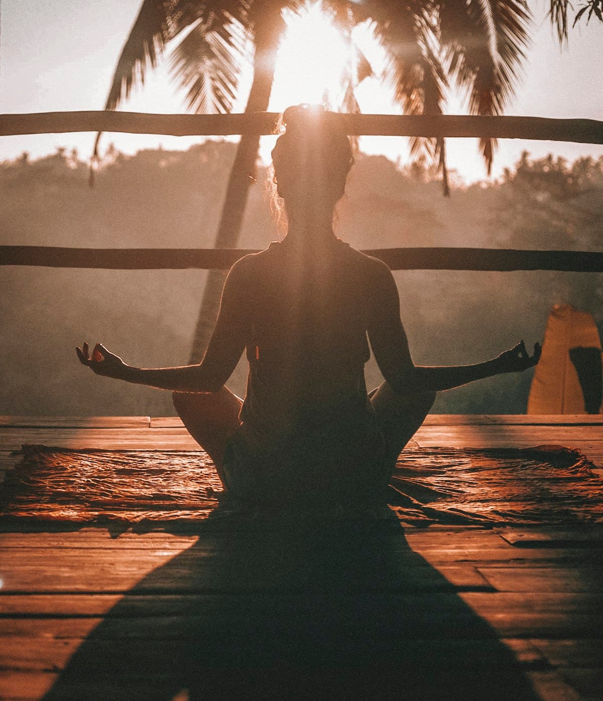 Person practicing meditation outdoors